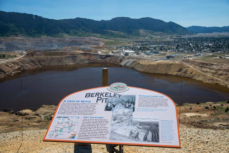 <p>The Berkeley Pit located in Montana opened in 1955. The primary use for it was to mine for copper. The depth grew to around 1,700 feet before it closed in 1982. Ever since it shut down, the pit became filled with over 900 feet of groundwater and rainwater.</p> <p>When you mix in the chemicals from the former mining operation, that water has become highly acidic. In fact, a 342-bird flock of snow geese died in there, which raised awareness of its danger.</p>