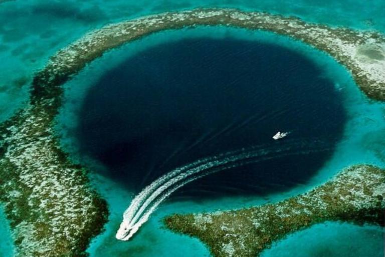<p>It's not often that giant holes are a prominent tourist attraction, but for the Great Blue Hole in Belize, that's not the case. This underwater sinkhole is off the coast and stretches 984-feet across and is nearly 450-feet deep.</p> <p>Scuba divers adore this nature gem as they all marvel at its crystal clear water and different species of sea life. The Great Blue Hole became famous after Jacques Cousteau mentioned it was one of the greatest places to dive in the world. </p>