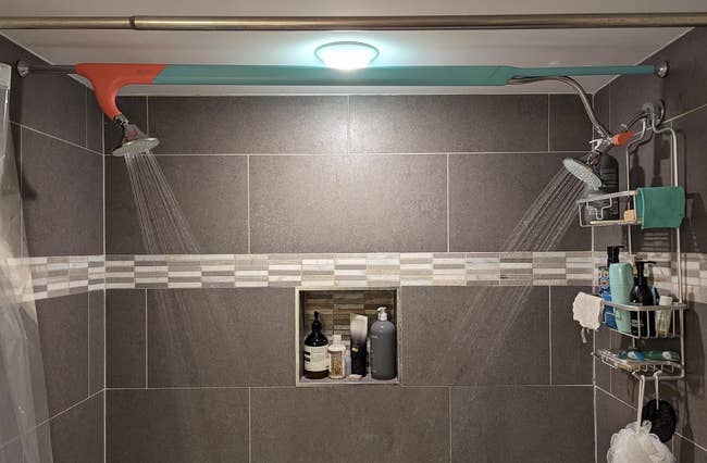 a reviewer photo of the double shoer heads installed