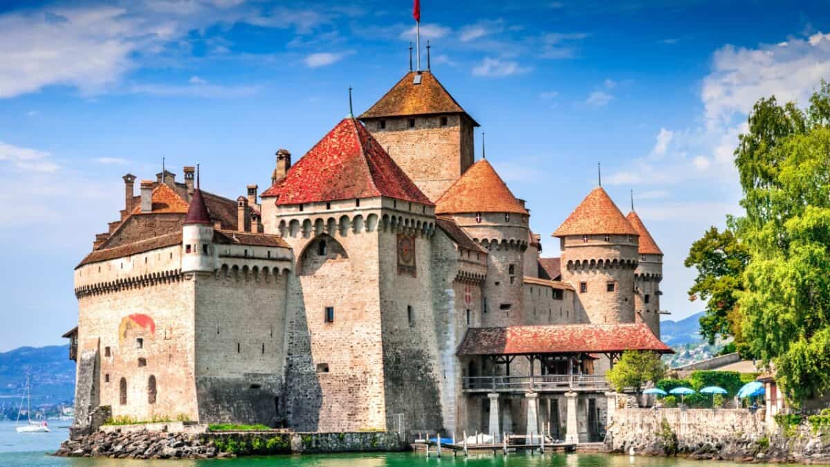 <p>Château de Chillon sits on a tiny island on Lake Geneva in Switzerland, right between the gorgeous towns of Montreux and Villeneuve. Built in the 11th century, it evolved from a humble fort into a grand castle guarding a key trade route. Explore the grand halls, spooky dark dungeons, and even a chapel.</p>