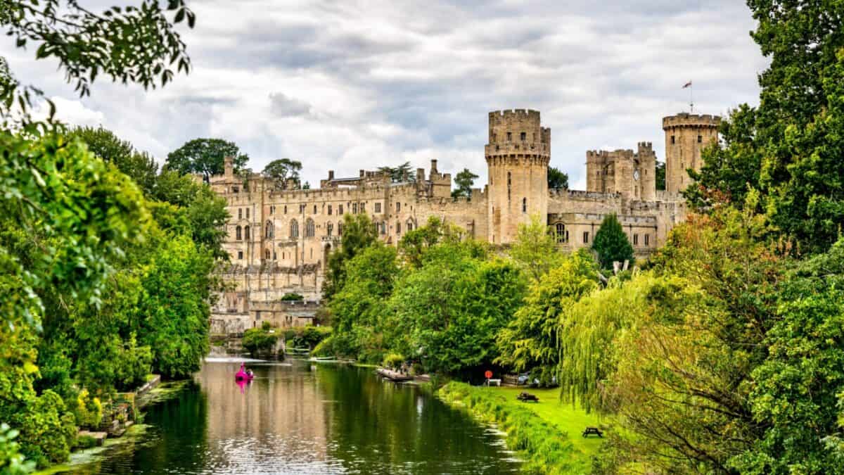 <p>Warwick Castle, built during William the Conqueror’s reign in 1068, boasts over 1100 years of history. Located in Warwick, England, by the River Avon, its natural defenses made it nearly impenetrable. </p><p>Explore the Great Hall, climb towers for epic views, and enjoy live shows like jousting tournaments and huge birds of prey on display. For a thrill, don’t miss the spooky Warwick Castle Dungeon!</p>