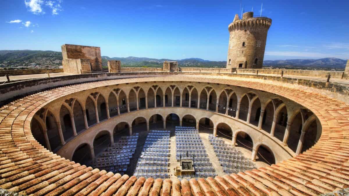 <p>Bellver Castle, one of Europe’s rare circular castles, crowns a hilltop overlooking the island of <strong><a href="https://www.flannelsorflipflops.com/things-to-do-in-palma-mallorca/">Mallorca, Spain</a>.</strong> Built in the 14th century by King James II of Majorca, it has served as a <a href="https://www.abc-mallorca.com/bellver-castle/">royal residence</a>, prison, museum, and currency factory. </p><p>Bellver means beautiful view in Catalan, and the stunning vistas of Palma and its sparkling waters are definitely Instagram-worthy!</p><p><strong><a href="https://www.flannelsorflipflops.com/things-to-do-in-palma-mallorca/" rel="noreferrer noopener">Read more about things to do in Palma Mallorca</a></strong></p>