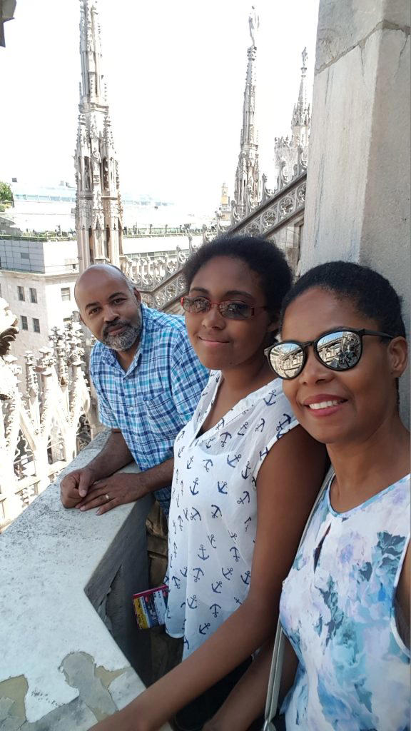 family on rooftop of duomo cathedral in milan