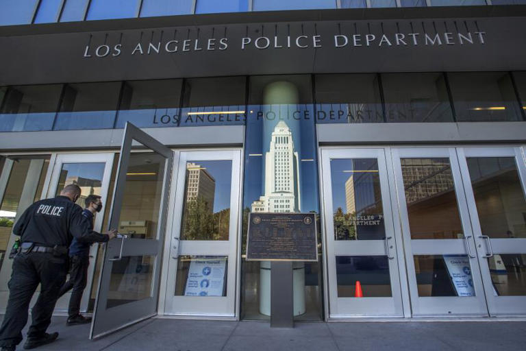 LAPD officer hit in ballistic vest, suspect wounded as shots exchanged ...