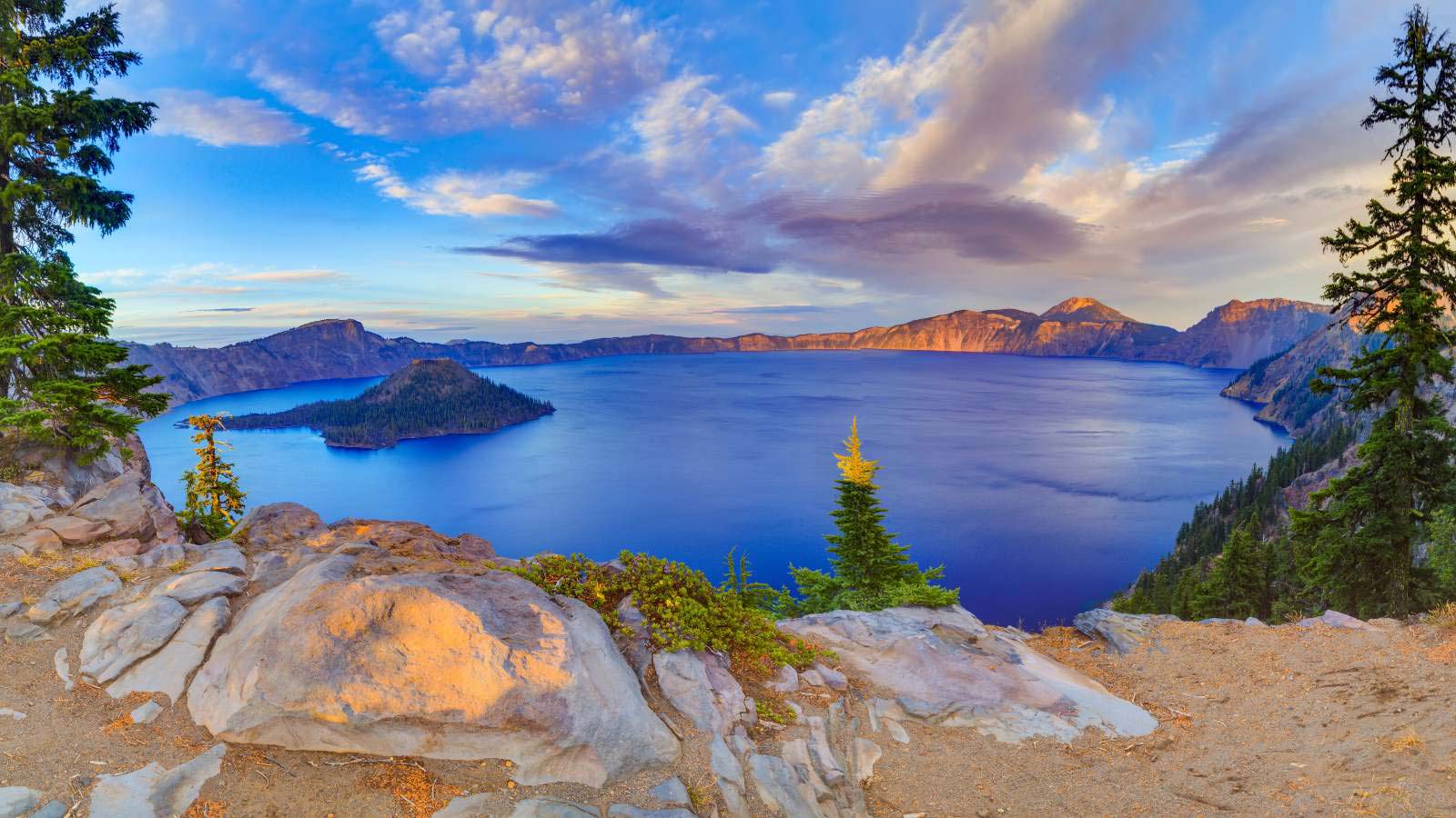 <p>Crater Lake National Park is amazing to see. It’s one of those places, if you sit there and look at it for a while, you’ll just i don’t know it’s just it’s a weird feeling looking at this thing. If you know the backstory of it and how it was created, it’s even more impressive. First of all, it’s the deepest lake in America; it’s 1943 feet deep. The lake’s water comes directly from snow or rain, which often happens in Oregon. And there are no inlets for the lake, and there’s no like little creeks going to it or anything like that. This mountain had its top blown off in a volcanic eruption.</p>