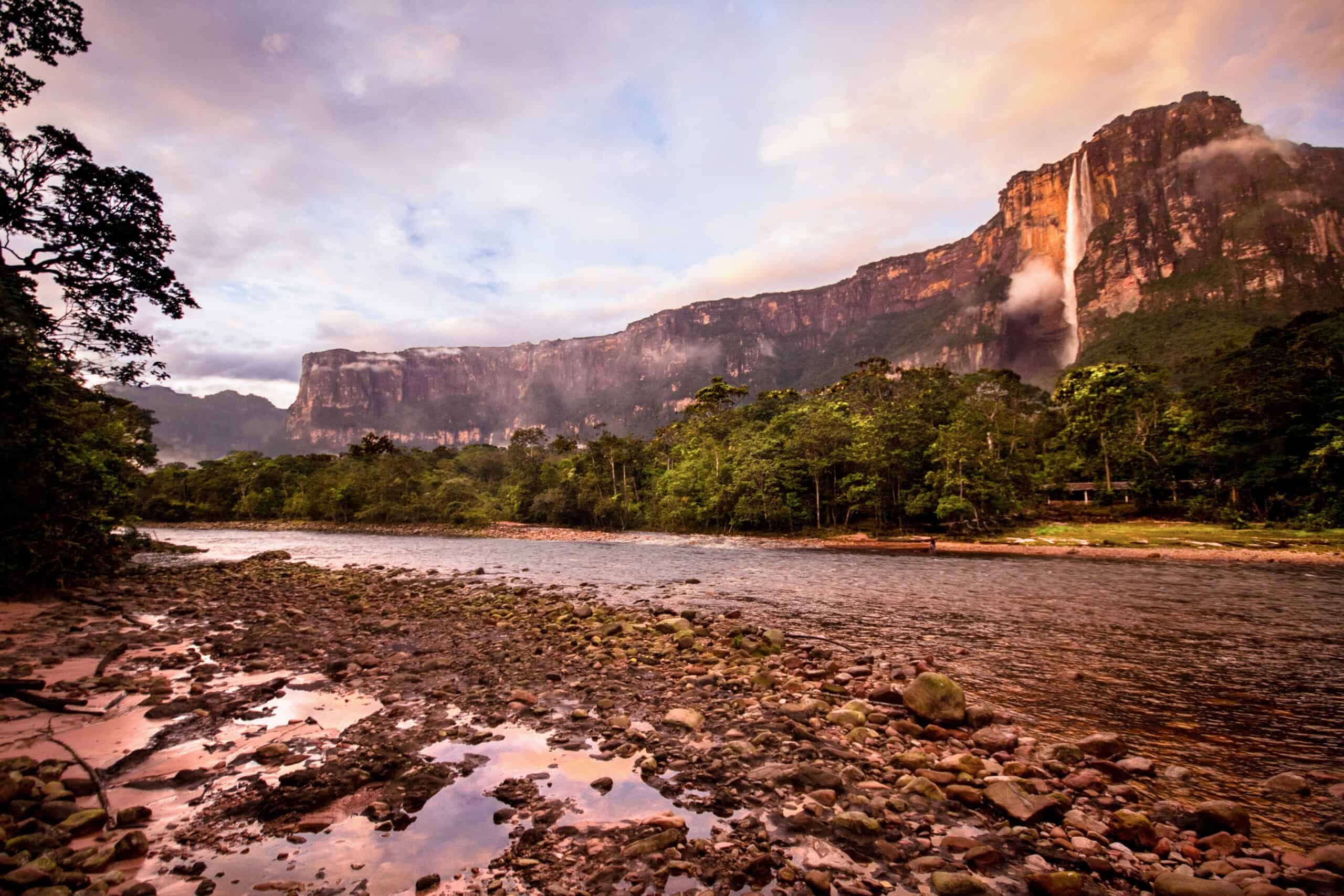 <p>Located in Venezuela’s Canaima National Park, Angel Falls is the world’s tallest uninterrupted waterfall, plunging an extraordinary 3,212 feet from the Auyán-tepui mountain. Named after aviator Jimmie Angel, who first flew over it in 1933, the falls are fed by the Churún River and create a mist that nourishes the lush rainforest below. </p> <p>Known as “Kerepakupai Merú” by the indigenous Pemon people, the falls offer a jaw-dropping spectacle that requires an adventurous journey by plane, boat, and foot to reach. This awe-inspiring natural wonder is a must-visit for thrill-seekers and nature lovers alike this summer.</p>