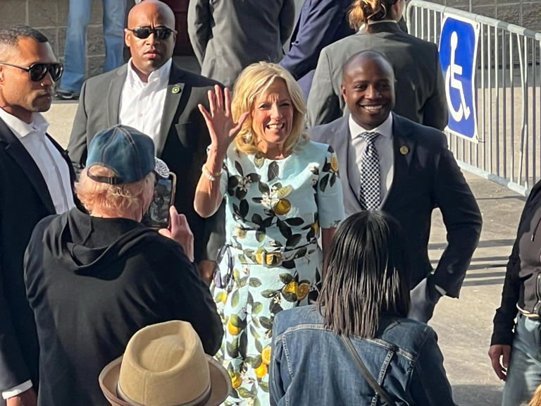 First lady Jill Biden, center, and Mayor Cavalier Johnson, right, waves to festivalgoers at Festa Italiana in Milwaukee on Friday.
