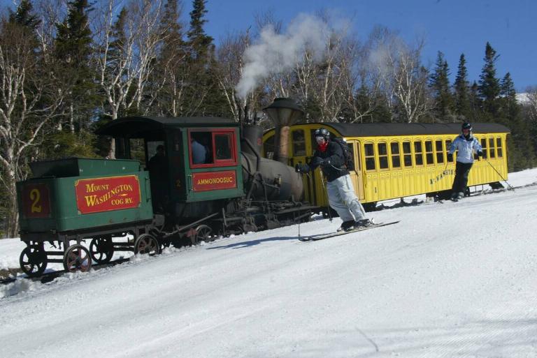 <p>In the middle of New Hampshire, the highest peak in the American Northeast, Mt. Washington, tours 6,288 feet into the air. During the late 1860s, engineers built the first mountain-climbing train in the world, which became <i>Mount Washington Cog Railway</i>.</p> <p>The three-hour train ride cuts through New Hampshire State Park and panoramic views of five other states. If the weather is clear enough, you can even see Canada! An onboard tour will direct your attention to the prettiest sights. For breathtaking views of the snow, board the train in winter.</p>