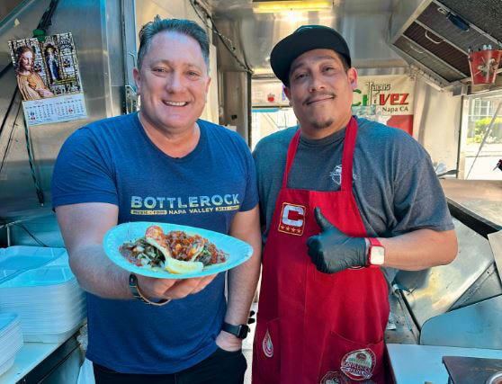Liam Mayclem with Chef Eddie Chavez of Chavez Tacos.