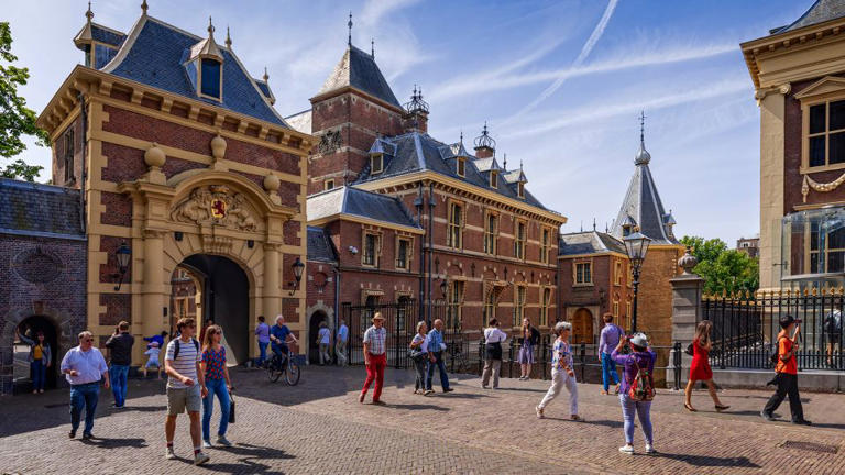 People walking around Binnenhof, the center of Dutch politics, in The Hague.