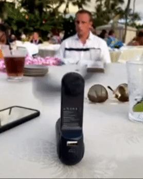 The fan propped on a table blowing air
