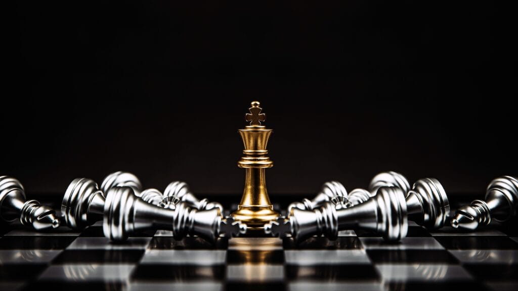 <p>Checkmate is derived from the Arabic phrase shāh māt, meaning “the king is dead.” This term is used in chess to indicate a winning move that traps the opponent’s king.</p>
