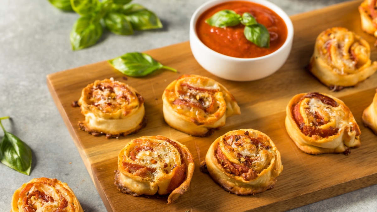 <p>Pizza in a convenient handheld form? Non-Americans are hooked. Pizza rolls combine the beloved flavors of pizza – gooey cheese, zesty tomato sauce, and savory toppings – in a portable snack. Whether enjoyed as an after-school treat or a late-night indulgence, pizza rolls are a hit around the globe.</p>