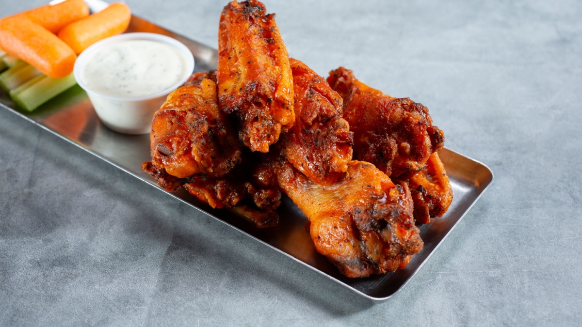 <p>The spicy, tangy allure of Buffalo wings has won over the hearts (and taste buds) of non-Americans worldwide. Whether enjoyed as a game-day snack or a casual appetizer, these crispy chicken wings drenched in fiery Buffalo sauce are impossible to resist. Paired with cool ranch or blue cheese dressing and crunchy celery sticks, Buffalo wings are a flavor sensation that transcends cultural boundaries.</p>
