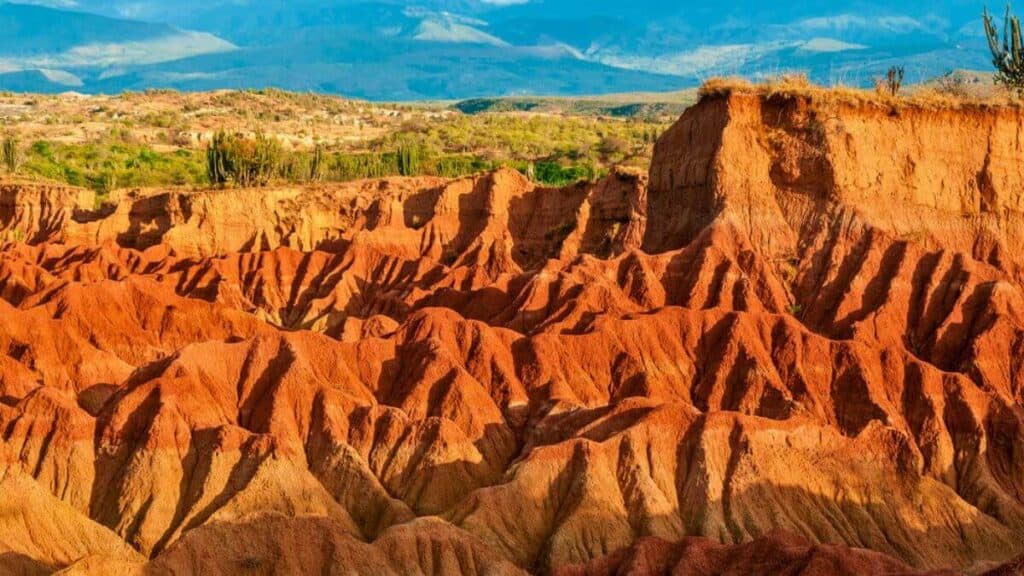 <p>Tatacoa Desert, found in Villavieja, Huila, is a unique spot to climb, explore, and stargaze. Divided into two parts, the Red Desert showcases red canyons and an observatory ideal for astronomy, while the Grey Desert resembles a moon-like landscape, earning it the name “The Valley of Ghosts.”</p>