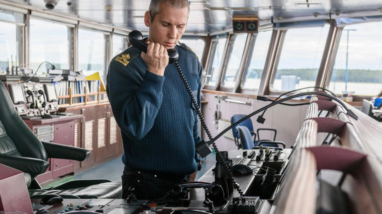 Cruise captain speaking into radio
