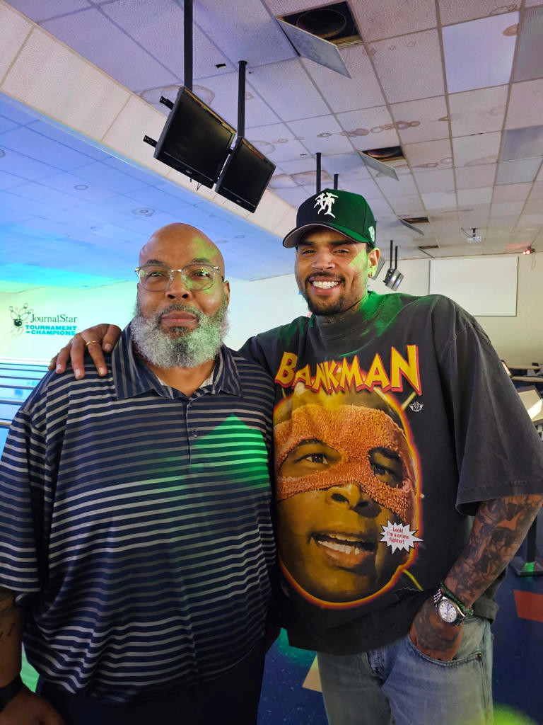 Landmark Lanes bowling general manager Vince Pollard (left) with R&B star Chris Brown during the artist's surprise visit in Peoria on Saturday, June 1, 2024.