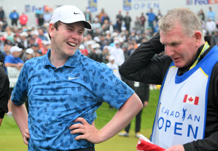 Robert MacIntyre celebrates on the 18th green with his father Dougie, who caddied for him, after winning the 2024 RBC Canadian Open. (Photo: Dan Hamilton-USA TODAY Sports)