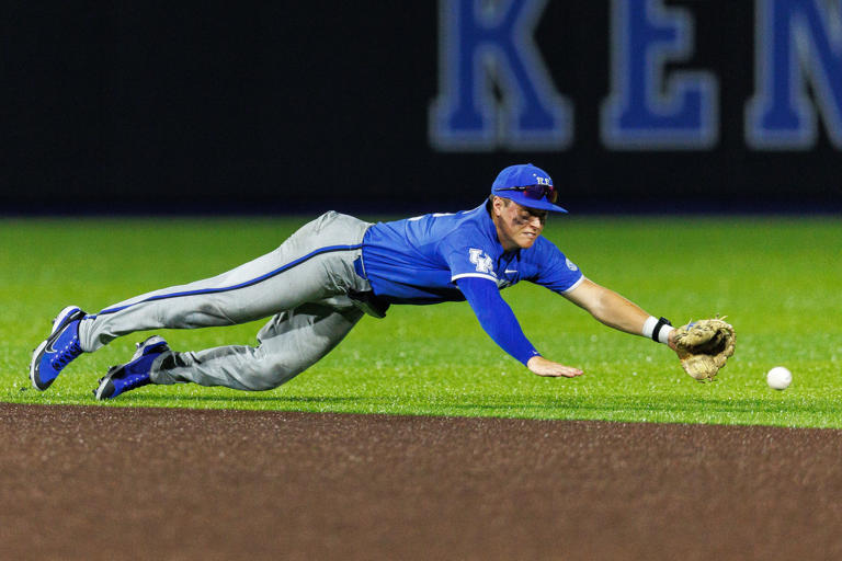 Jun 2, 2024; Lexington, KY, USA; Kentucky Wildcats infielder Grant Smith (12) dives for the ball during the eighth inning against the Indiana State Sycamores at Kentucky Proud Park. Mandatory Credit: Jordan Prather-USA TODAY Sports