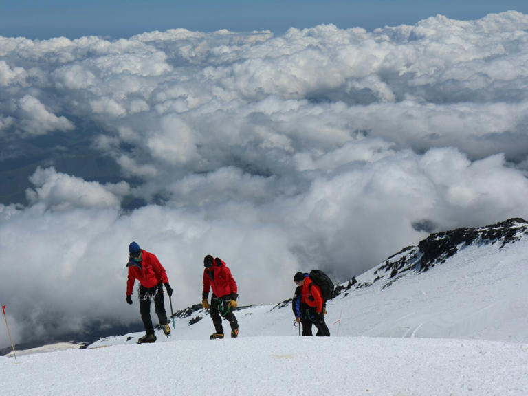 Climbers scaling a mountain.