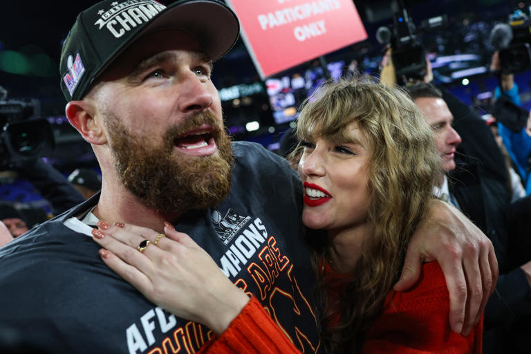 Travis Kelce #87 of the Kansas City Chiefs (L) celebrates with Taylor Swift after defeating the Baltimore Ravens in the AFC Championship Game at M&T Bank Stadium on January 28, 2024 in Baltimore, Maryland. Five months later, Kelce made headlines when a photo of the alleged lock screen on his phone went viral.