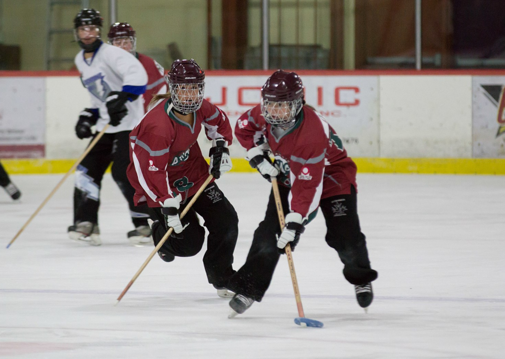 <p>Ringette is a Canadian game that is played on ice, in which two teams of women on skates compete to drive a plastic ring into the other team's goal with a straight stick, similar to hockey. The sport was invented in 1963 by Sam Jacks, who introduced the game in Ontario. Ringette grew in popularity and in 1974, the <a href="https://www.ringette.ca/our-sport/history-of-ringette/">national governing body for the sport</a> was formed.</p>