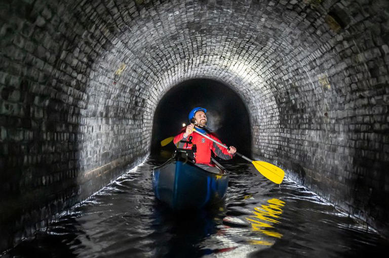 Canal & River Trust team leader Gordon McMinn, canoes through Standedge Tunnel on the Huddersfield Narrow Canal