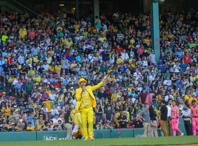 Saturday, June 8, 2024; Boston MA-Savannah Bananas owner and Massachusetts native Jesse Cole pumps up the crowd during the Savannah Bananas first Banana Ball game at Fenway Park on Saturday, June 8, 2024.