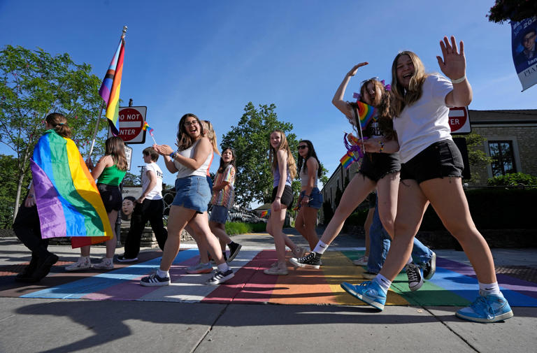 People who participated in Bexley’s Pride Walk crossed a rainbow painted in the driveway adjacent to the Bexley Public Library on Main Street earlier this month.