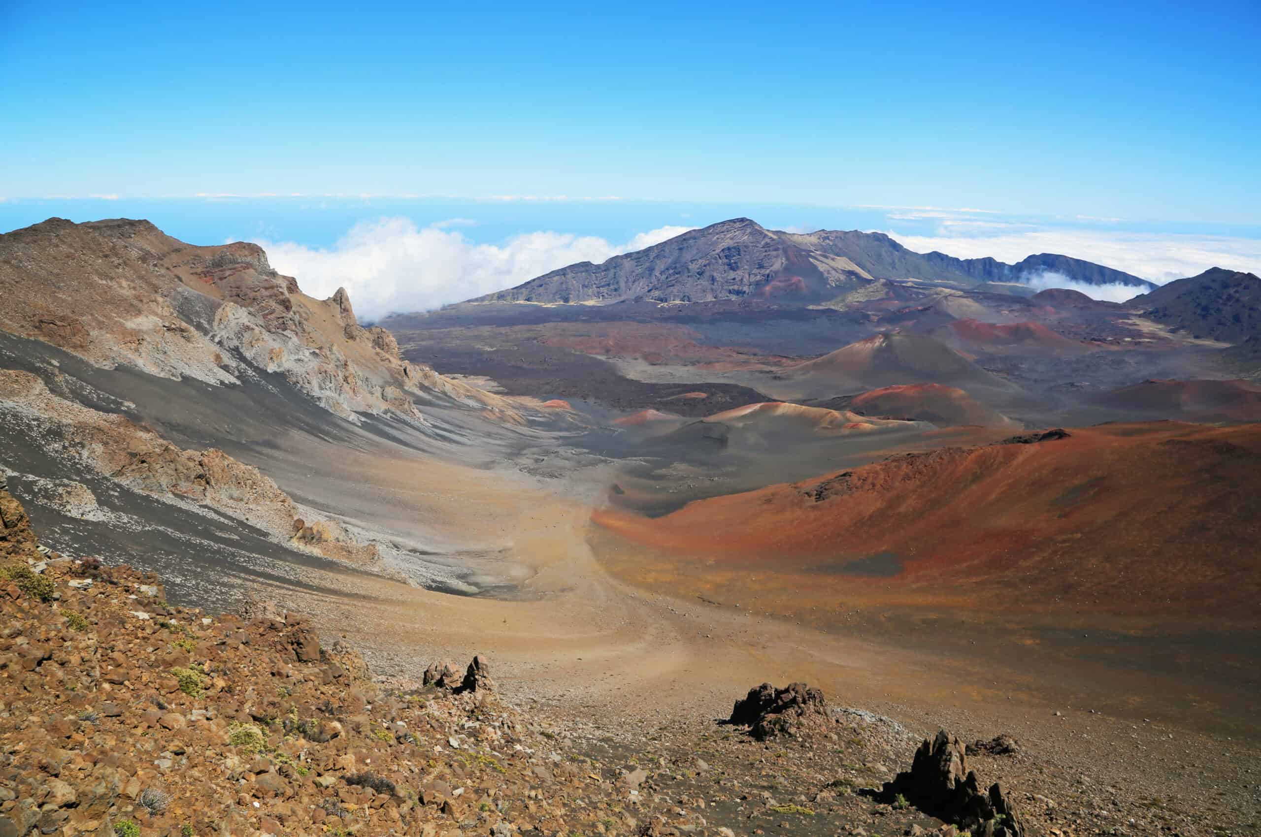 <p>Haleakalā National Park on Maui is renowned for its stunning sunrises, dramatic volcanic landscapes, and diverse ecosystems. The park features the massive Haleakalā Crater, a dormant volcano rising over 10,000 feet, offering imposing views and distinctive geological formations. </p> <p>While the park’s beauty is undeniable, it presents significant hazards like challenging hikes, sudden weather changes, and high altitudes that can cause sickness. Visitors are drawn to its awe-inspiring scenery but must be well-prepared to safely navigate its rugged and variable conditions.</p>
