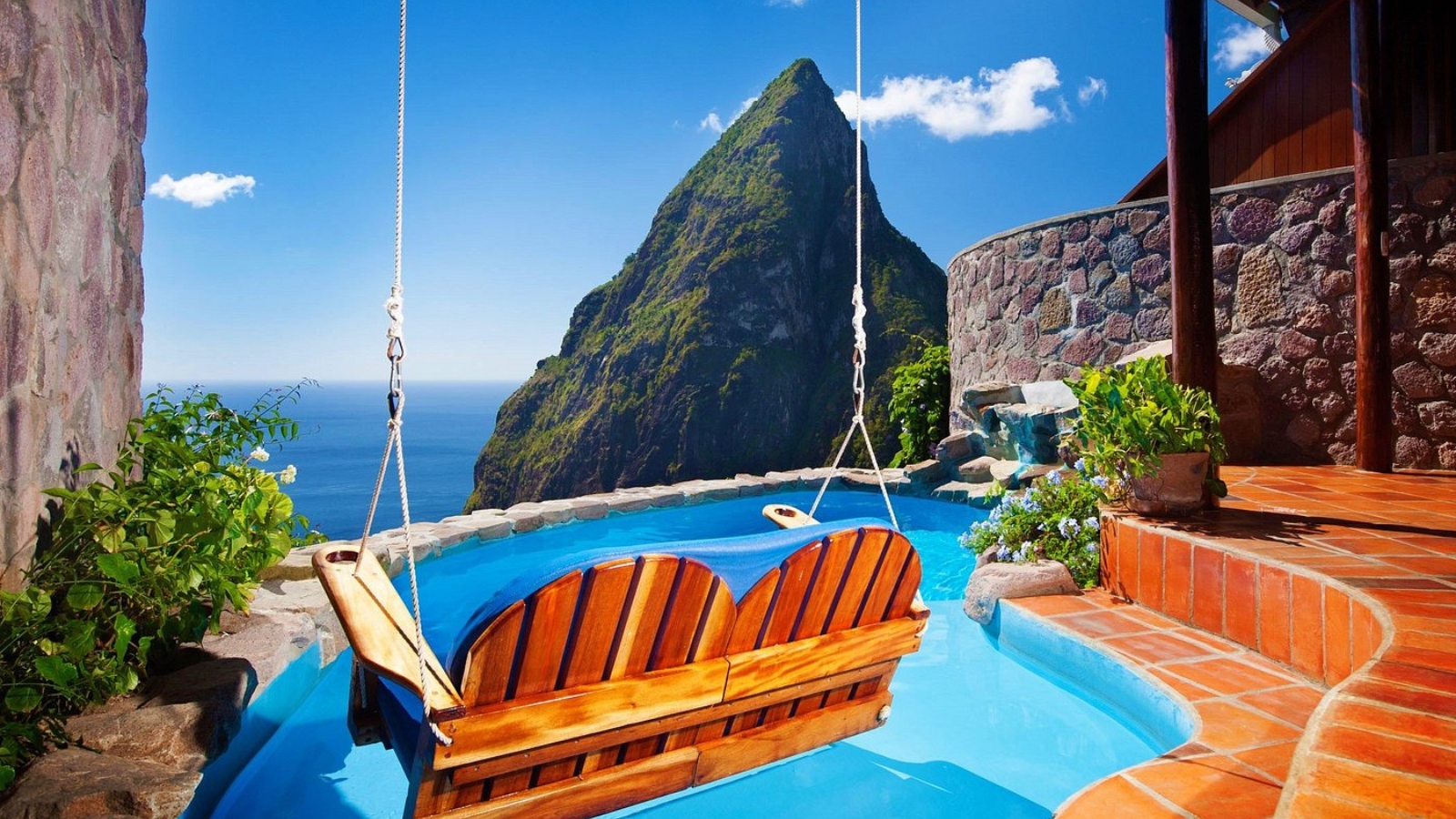 <p>Perched on a volcanic ridge 1,000 feet above the Caribbean Sea, Ladera Resort offers open-air suites with breathtaking views of St. Lucia’s iconic Pitons. Each suite features a private plunge pool and an open fourth wall, allowing guests to fully immerse themselves in the island’s natural beauty. </p> <p>Established in 1992 on a former cocoa plantation, the resort blends historical charm with luxurious, eco-friendly design using locally sourced materials. With its award-winning Dasheene Restaurant and a focus on sustainability, Ladera Resort provides a unique and extravagant experience, perfect for travelers seeking a luxurious connection with nature.</p>