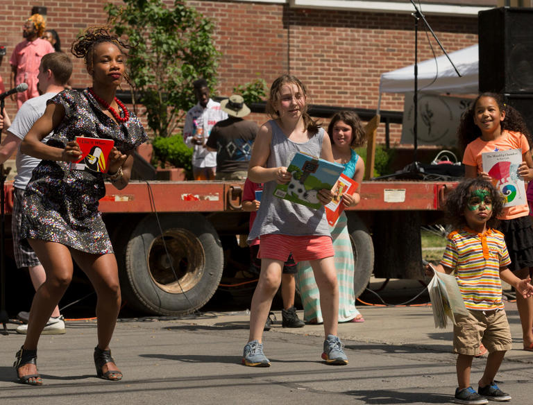 Nia Nunn, left, leads children in a dance performance designed to get the community excited about reading books from the Family Reading Partnership. The dance was a small piece of a day-long celebration of Juneteenth at the Southside Community Center in Ithaca in 2016.
