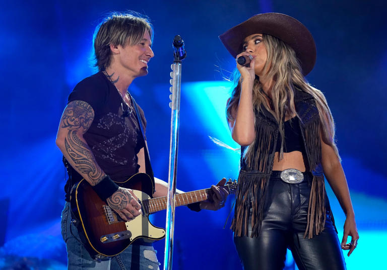 Keith Urban performs with Lainey Wilson during CMA Fest at Nissan Stadium in Nashville, Tenn., Saturday, June 8, 2024.