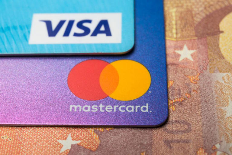 POLAND - 2020/01/03: In this photo illustration a Visa credit card and Mastercard debit card are seen displayed. (Photo Illustration by Karol Serewis/SOPA Images/LightRocket via Getty Images)