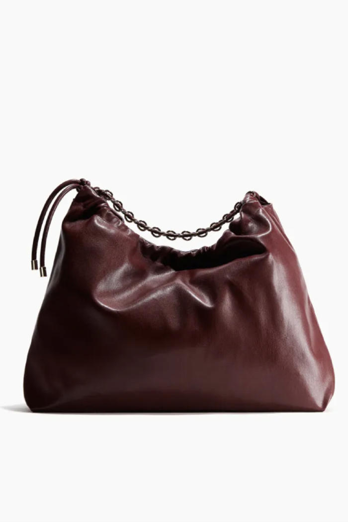this £33 h&m shoulder bag is a dead ringer for loewe's £3.3k slouchy shopper and i'm taking it everywhere from work to picnics in the park