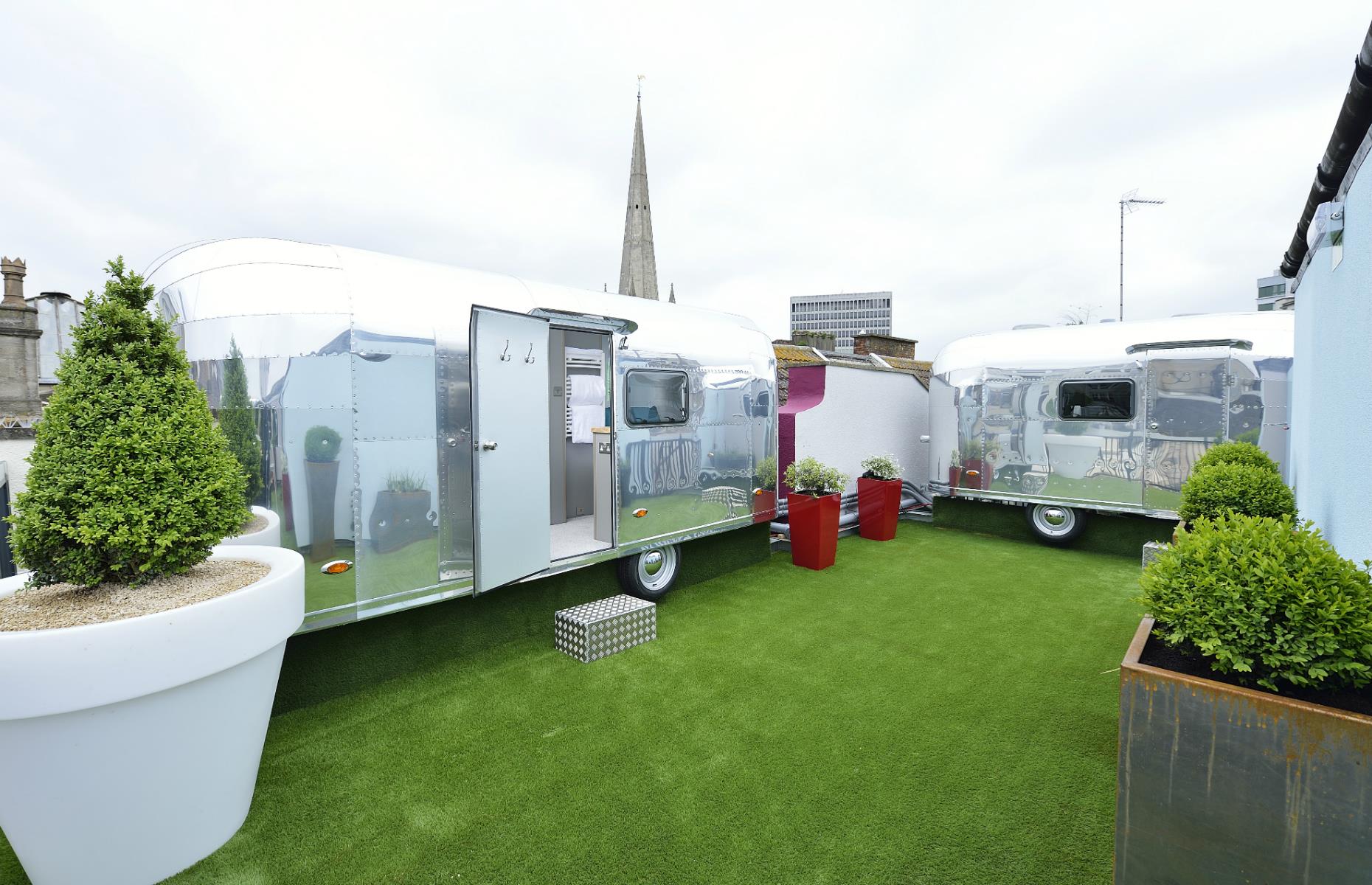 <p>Bristol is a trend-setting city and now you can stay in one of four vintage <a href="https://hostunusual.com/property/brooks-rooftop-rockets/">Airstream-style trailers</a> on the rooftop of a boutique hotel in the heart of the old town. While these particular trailers are British-made, they evoke the charm and nostalgia of their American counterparts with finesse.</p>