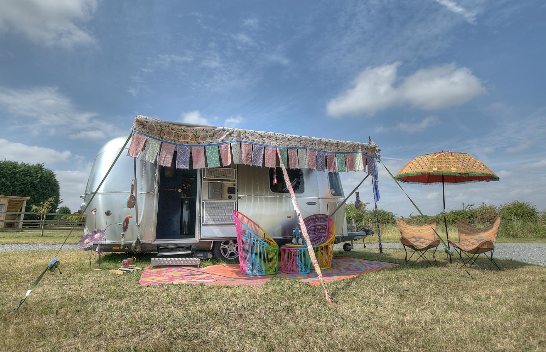 <p>This colorful <a href="https://www.ettiesfield.com/">Airstream</a> has everything you need for a comfortable self-catering getaway, including a deluxe kitchen, en-suite bathroom and a double bed. ‘Ettie’ also benefits from a scenic countryside location, with a herd of alpacas on site to boot. Dogs are welcome too.</p>