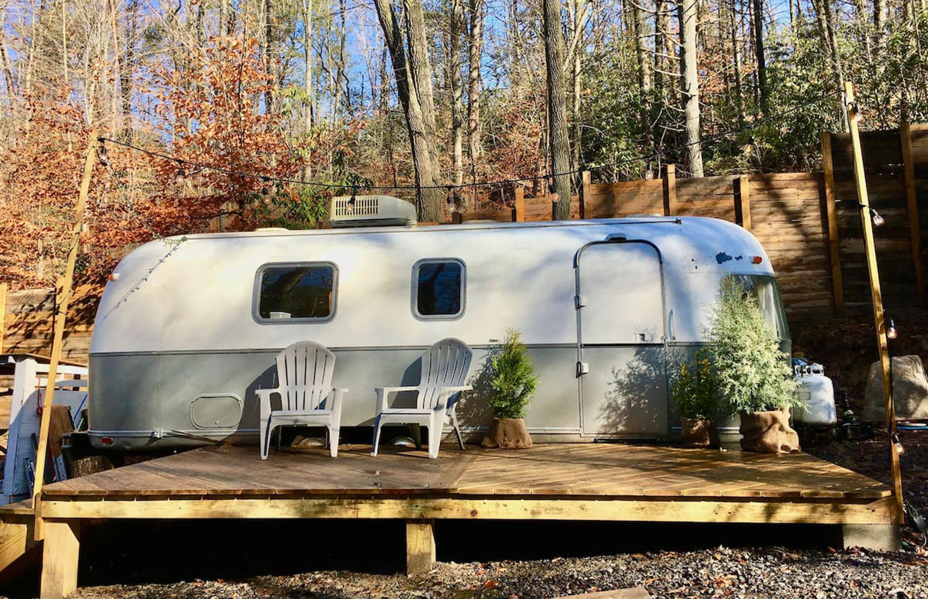 <p>The RhodoDen is a cosy 1974 <a href="https://www.airbnb.com/rooms/40321685?source_impression_id=p3_1718032329_P3Bn8YMECr5YLQDj">Airstream Argosy</a> nestled among the rhododendrons of North Carolina’s gorgeous Blue Ridge Mountains. Set beside a picturesque creek, it makes the perfect base to relax, hike mountain trails or enjoy the dining and nightlife in nearby Asheville and Black Mountain.</p>