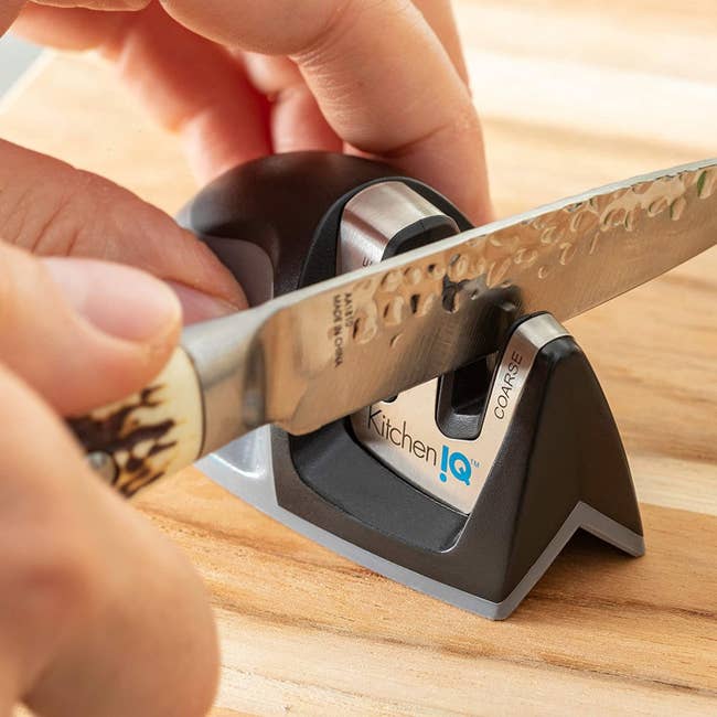 Hand using the sharpener