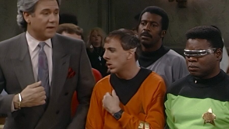 <p>While it’s cool to see Star Trek actors appear in Night Court, nothing is quite as funny as seeing the courtroom comedy completely mock this sci-fi fandom in the episode “Yet Another Day in the Life.” That ep doesn’t feature any Trek actors (unless you count John Larroquette), but it does involve bickering fans being brought to court after they began fighting at a Star Trek convention. Part of their disagreement was over whether The Original Series or The Next Generation was better, and part of it was about whether Kirk would have violated some made-up rule preventing androids from serving on the bridge.</p><p>We’re still not sure what the heck the android rule the “old Trekkies” are talking about in this episode is, but we can’t help but laugh at how well this Night Court episode understands the Trek fandom. Decades after the episode aired in 1989, fans are still debating which Star Trek shows are better and what William Shatner’s Captain Kirk would or would not do in various circumstances. That makes the episode title very “meta,” as the nerd debates we see onscreen represent just another day in the life of being a Trek fan.</p>