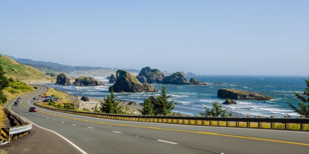 <p>While the Pacific Coast Highway is a popular section, Highway 1 continues north from there, offering stunning coastal views, picturesque towns, and attractions like the Oregon Dunes National Recreation Area and Olympic National Park in Washington.</p><p>In Oregon, road trippers will encounter gorgeous coastal landscapes, including rugged cliffs, old lighthouses, and beaches. The iconic Haystack Rock in Cannon Beach and the charming town of Astoria are among the highlights. As the route extends into Washington, the scenic drive showcases dramatic coastal scenery, with rocky shorelines, forests, and charming seaside towns like Long Beach and Ocean Shores. Travelers can explore the scenic beauty of Olympic National Park, which features old-growth forests and snow-capped mountains. </p>