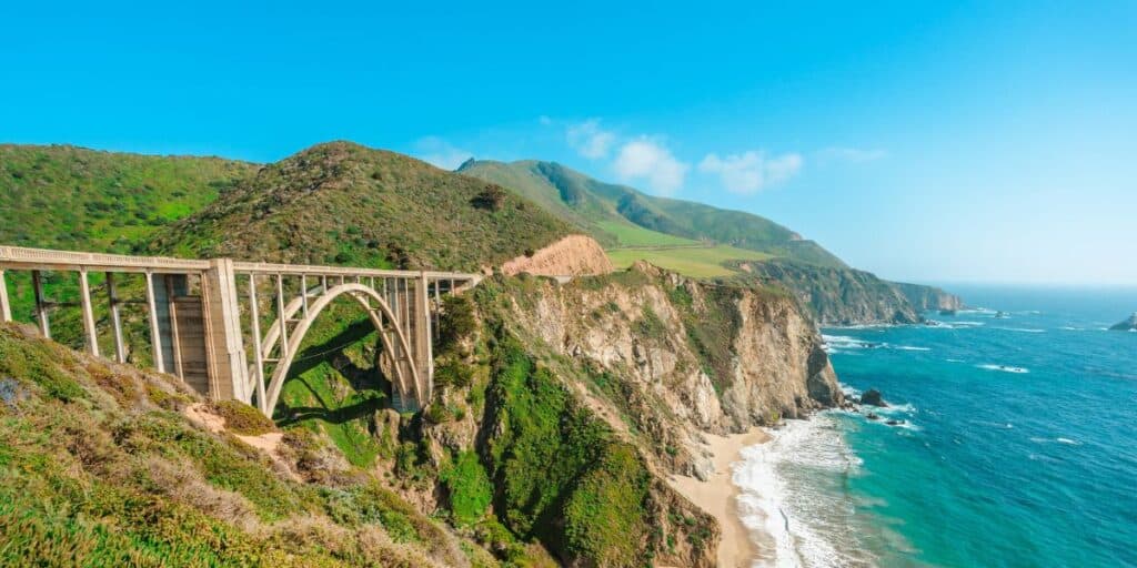 <p>This iconic route stretches along the California coast, offering breathtaking views of the Pacific Ocean, coastal towns, and attractions like Big Sur, Monterey, and Santa Barbara.</p><p>Along the way, you can see iconic landmarks like the Bixby Creek Bridge and McWay Falls in Big Sur. Santa Barbara and Monterey provide opportunities to explore sandy beaches, indulge in delicious seafood, and immerse yourself in the laid-back coastal culture. You can also visit attractions like Hearst Castle, a magnificent mansion overlooking the ocean, and the famous Santa Monica Pier in Los Angeles.</p>