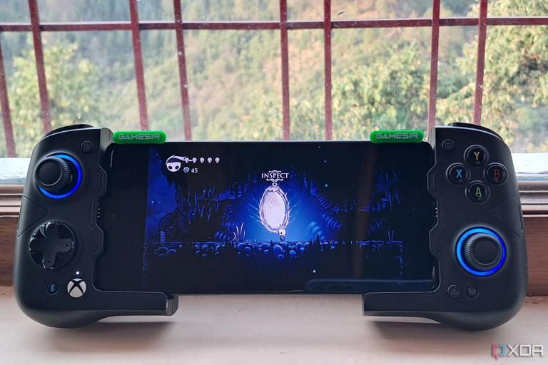 A GameSir X4 Aileron controller connected to a Poco F5, with the phone running Hollow Knight via Winlator