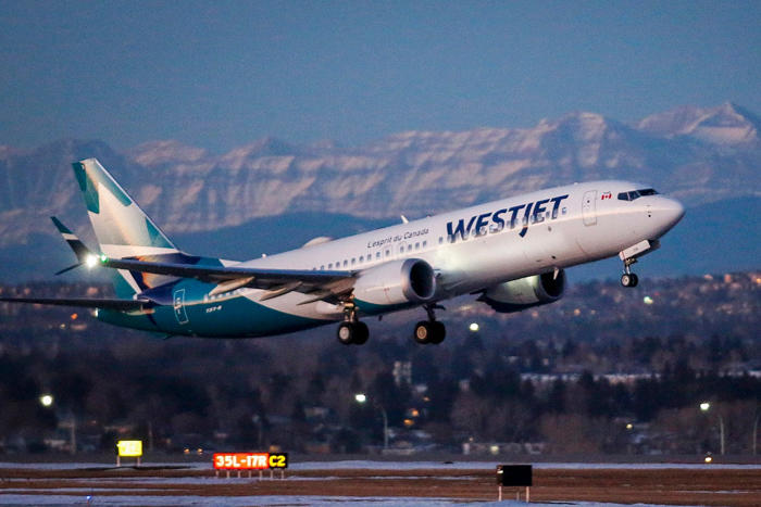 canadian airline westjet cancels at least 235 flights following a surprise strike by mechanics union