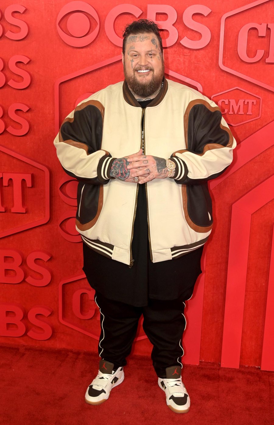 <p>His past may serve as a cautionary tale, but <a href="https://www.usmagazine.com/celebrities/jelly-roll/"><strong>Jelly Roll</strong></a> takes solace in knowing his present-day has become a motivator for many.</p> <p>In <em>Us Weekly</em>’s “Country Stars Love America” issue, the “Save Me” singer, 39, looked back on his whirlwind year and recalled how his past — which included being in and out of jail for a decade — led him to becoming a chart-topper. “There were moments in my life that were so dark, there was absolutely no hope or sense of there being something else [other than] that,” Jelly Roll (real name: Jason Bradley DeFord) told <em>Us</em>. “I wouldn’t have known to dream anything otherwise, and definitely not to the extent of what the past year alone has brought.”</p> <p>And what a year it’s been: Since 2023, Jelly Roll has won multiple awards, celebrated opening a recording studio in his former juvenile detention center and testified in Washington, D.C. about the dangers of fentanyl. Yet, he had an enlightening moment on June 6, when he <a href="https://www.usmagazine.com/entertainment/news/behind-the-scenes-at-cma-fest-2024-performances-artist-interviews/">performed at CMA Fest</a> at Nissan Stadium — which shares a parking lot with the juvenile detention center he spent time in as a teenager — in Nashville.</p> <p>“I could hear the football games and the concerts from the cell I was in, and I just headlined a show for more than 50,000 people, and hosted the CMA Fest TV special there,” he shared. “I was standing in the same exact place [at] a completely different place in life.”</p> <p><a href="https://www.usmagazine.com/celebrity-moms/news/jelly-rolls-family-guide-meet-his-two-children-and-wife-bunnie-xo/">Jelly Roll’s Family Guide: Meet His Two Children and Wife Bunnie XO</a></p> <p>“I don’t know if there is a moment of more perspective than that to illustrate how different my life could have been and how different it is now,” the “I Am Not Okay” singer continued.</p> <p>According to the musician, the awards and accolades mean nothing if he’s not using his platform to pay it forward. “I want to let people know they are not alone in what they are going through, and that there is something ahead that can be so much greater than what you could have imagined if you are able to commit to making the change you need to,” he told <em>Us</em>. “I want to keep reminding people the windshield is bigger than the rearview mirror for a reason.”</p> <p>“Music granted [me] purpose and enabled me to reach people,” he added. “I hope my story inspires them to find whatever that is for them.”</p> <p>Here, Jelly Roll recounts his recent incredible run in his own words before hitting the road for the <em><a href="https://jellyroll615.com/pages/2024-headline-tour">Beautifully Broken Tour</a></em>, kicking off August 27.</p>