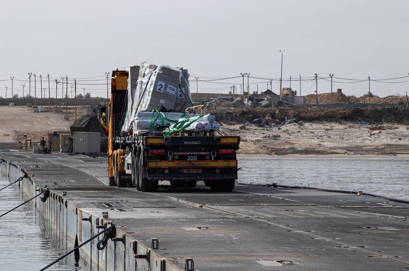 gaza pier resumes operations as aid collects in marshalling area