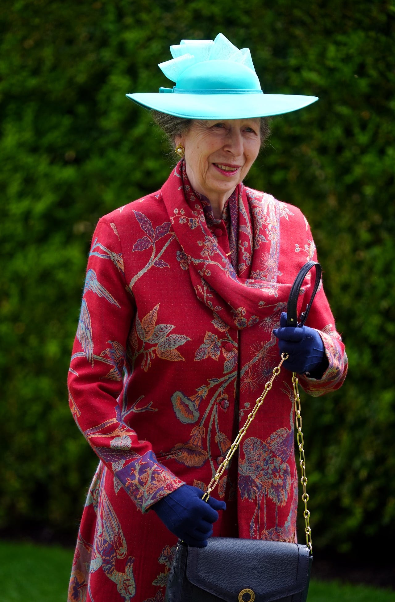<p>Anne, known for her unique and daring approach to fashion, opted to repurpose one of her favorite outfits for her debut at Royal Ascot 2024.</p><p>According to <a href="https://www.hellomagazine.com/fashion/royal-style/694033/princess-anne-recycles-red-coat-royal-ascot/">Hello! Magazine,</a> she wore a botanical-printed cashmere and silk red coat designed by Shibumi. The Princess Royal, 73, accessorized with deep-blue gloves, a gold-chain black handbag, and a quirky turquoise hat.</p>