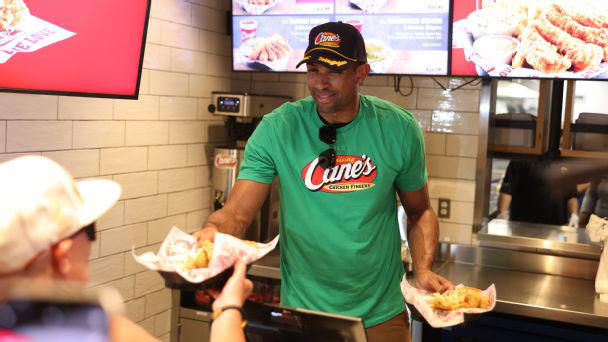 al horford hands out food to fans at raising cane's in boston