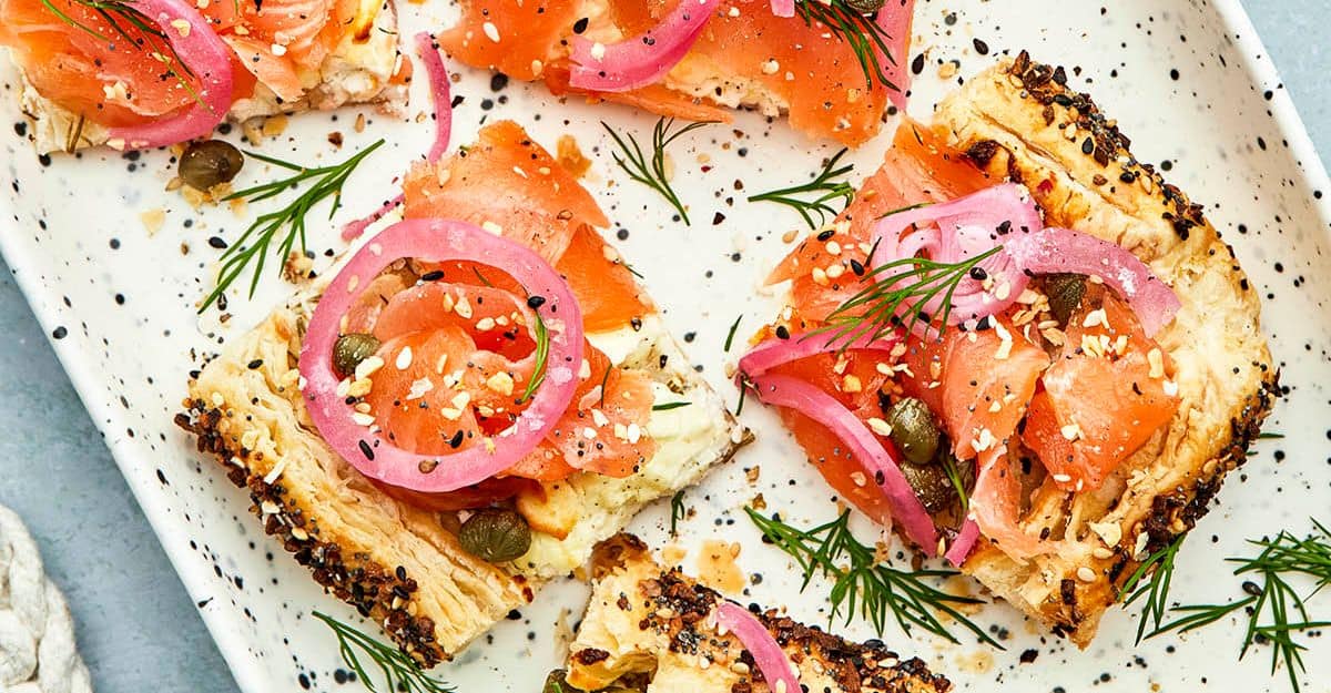 <p>This delicious dish can be a great brunch or appetizer. It is made from frozen puff pastry, smoked salmon, and goat cheese. It is perfect for when you want a quick fix.</p> <p>Get the recipe: <a href="https://kellyneil.com/smoked-salmon-puff-pastry-tart/?fbclid=IwZXh0bgNhZW0CMTAAAR1dCO8V50ijw8rfWMSzSzcVsFu0nNJXuL1F8iTrwDfIBScjRe-BNacrH4w_aem_ZmFrZWR1bW15MTZieXRlcw" rel="noreferrer noopener">Smoke Salmon Puff Pastry Tart</a></p>