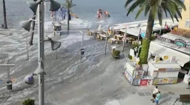 The sea suddenly swallowed up the beach and became level with restaurants (Picture: Solarpix)
